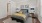 a bedroom with a bed and lamps