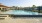 a swimming pool with a fence around it