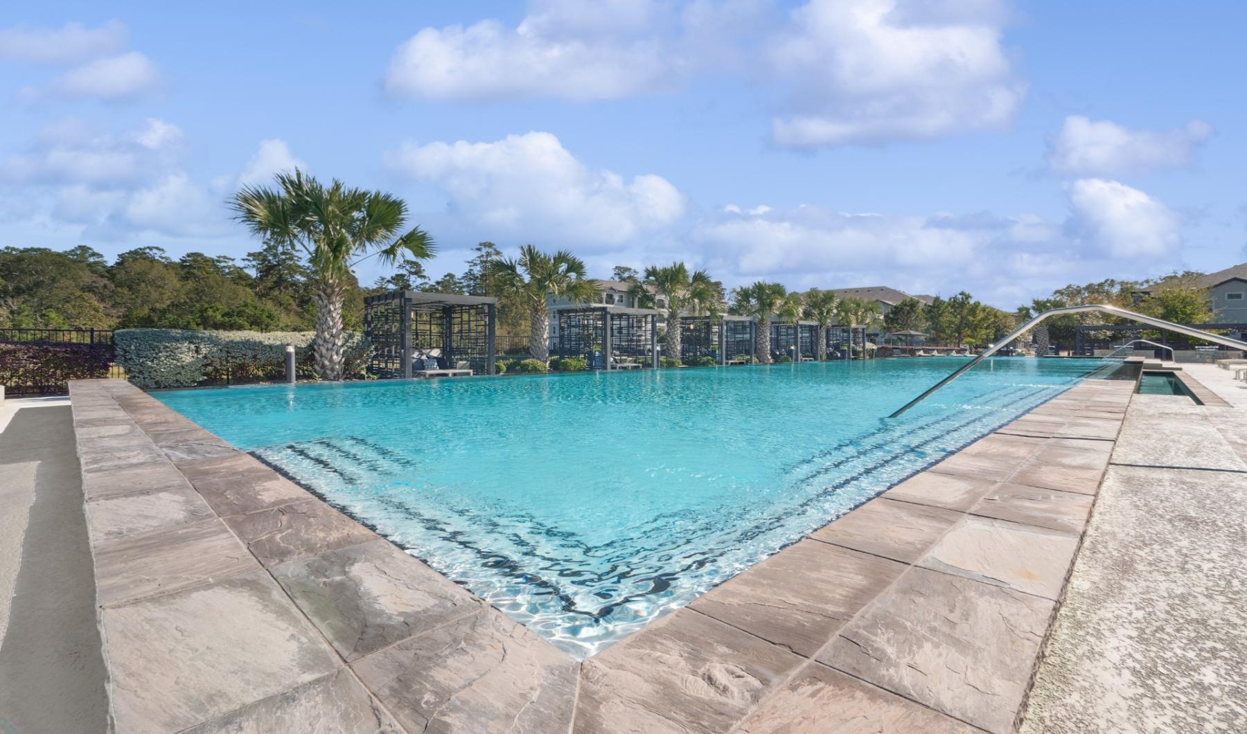 a pool with a building in the background