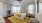 a bedroom with a bed and a fan