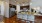 a kitchen with a marble counter