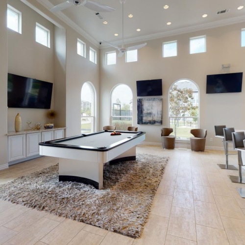 a large room with a large table and chairs
