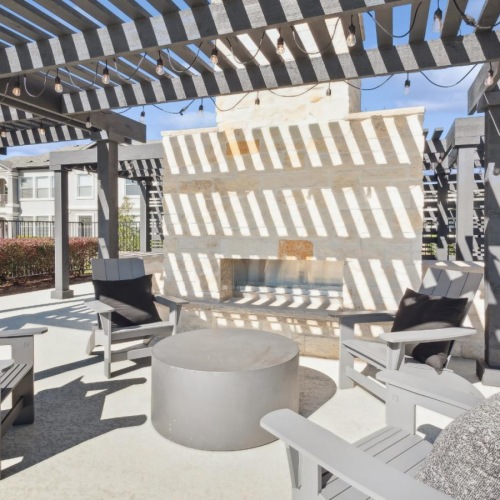 a patio with chairs and a covered patio